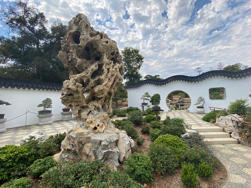 Rocks, water, plants and structure create a visual poetry in Chinese Garden Design. (KimberlyUs)