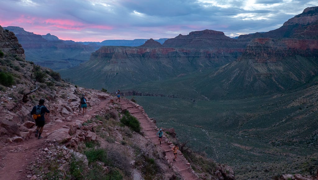 Descending into the Grand Canyon via the South Kaibab Trail at sunrise.