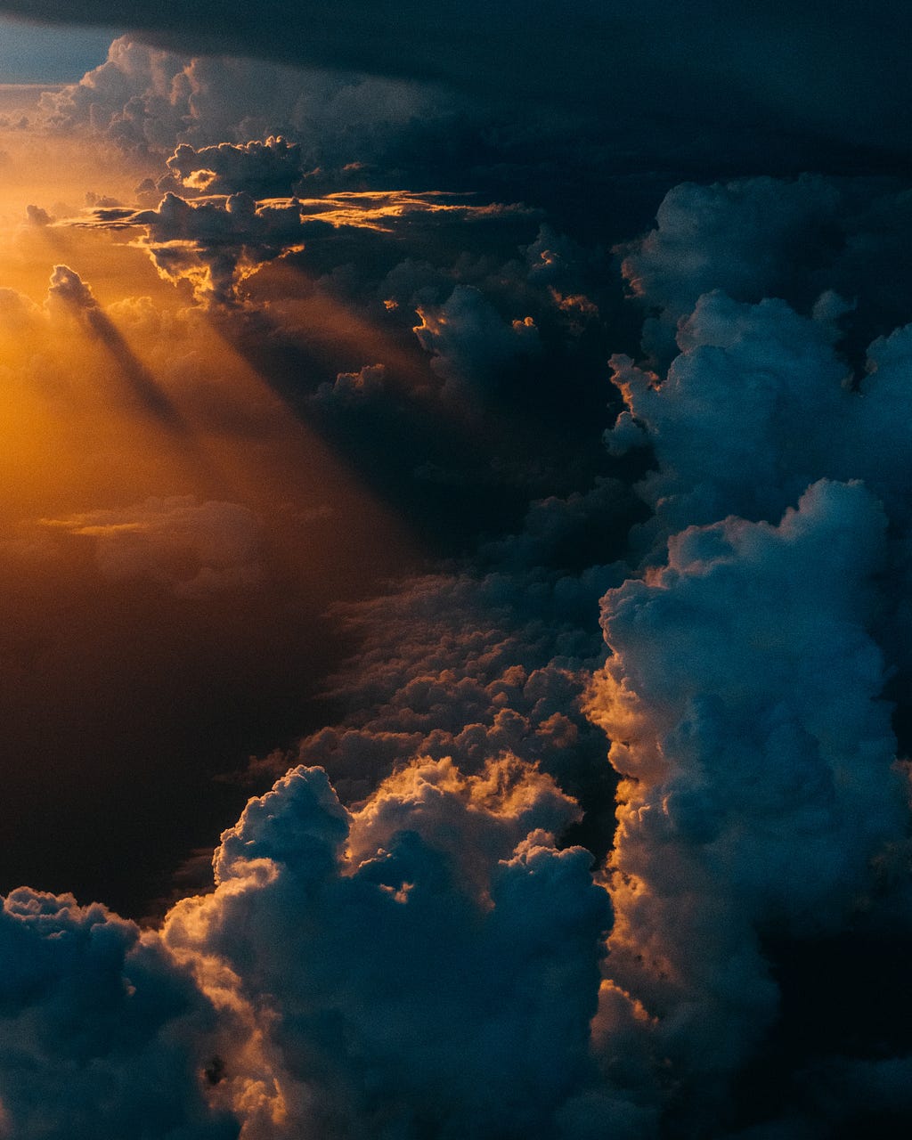 A photo of clouds that looks like heaven — photo by Tom Barrett on Unsplash
