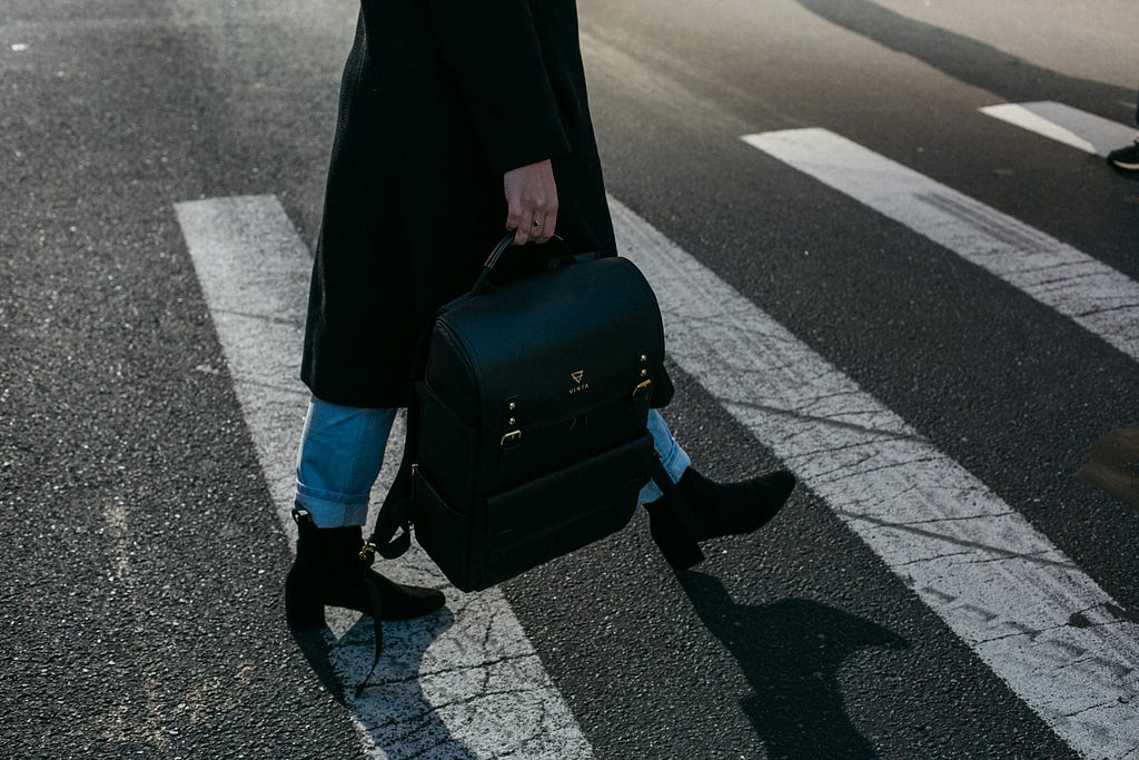 Woman crossing the crosswalk.