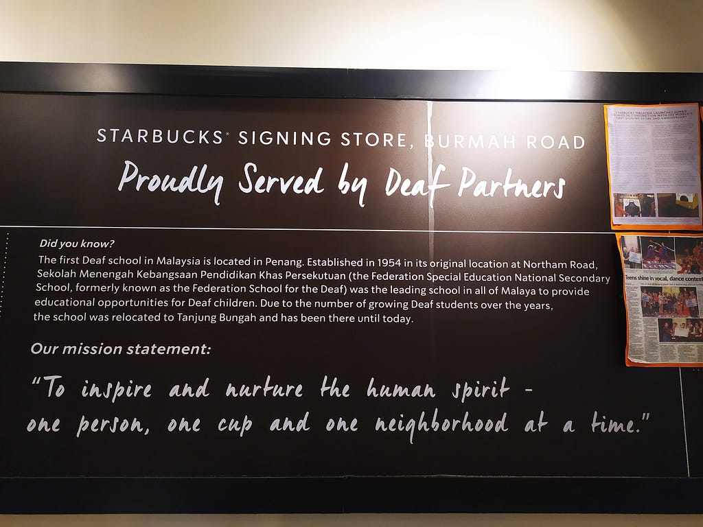One of the boards in the wall of Starbucks Signing Store in Penang, explaining the history of Penang Deaf Association. The board also lists Starbucks mission statement “To inspire and nurture the human spirit. One person, one cup, and one neighborhood at a time”.
