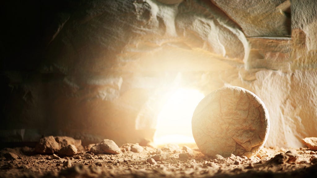 Easter morning showing the stone rolled away from Jesus’ tomb and light shining from within the tomb.