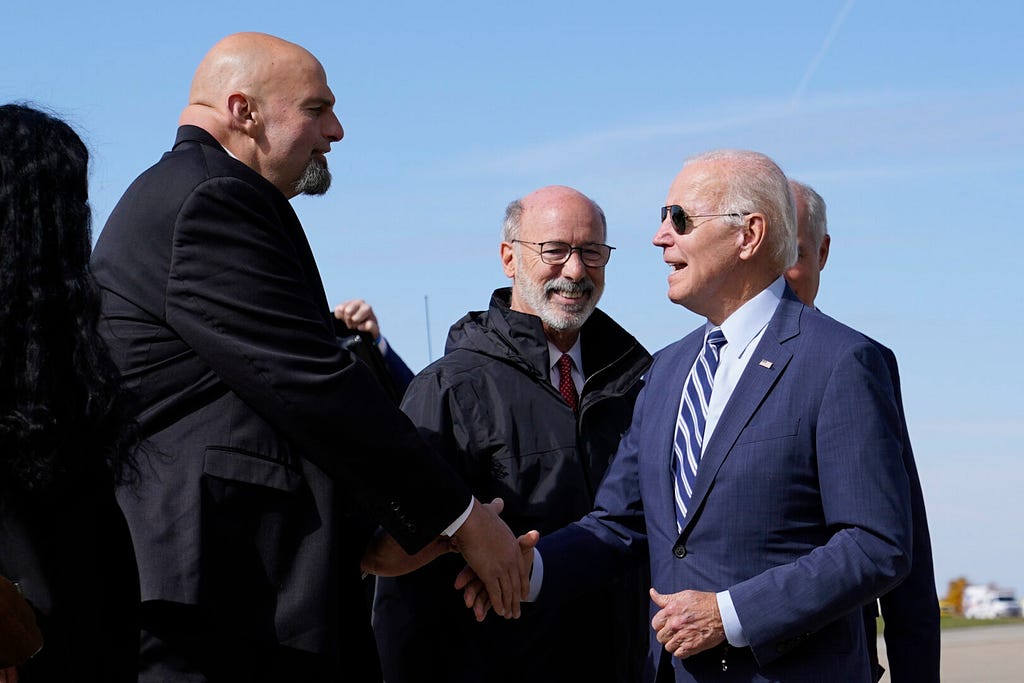 President Biden shaking hands with future Senator & current Lt. Governor of Pennsylvania John Fetterman, standing next to PA Governor Tom Wolfe.