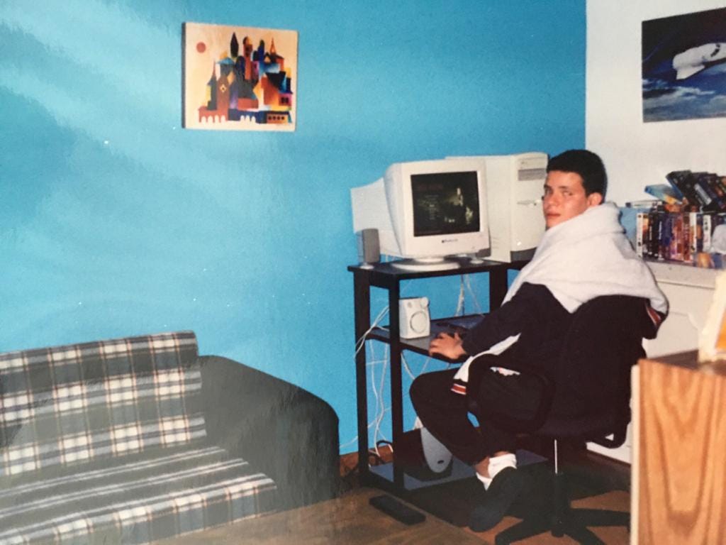 An old as the time photo of me playing a computer videogame when I was in my teen years.