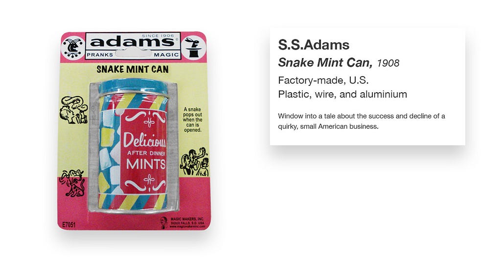 Picture of the snake mint can in its original packaging with what looks like a museum label with the following text: “S.S. Adams; Snake Mint Can, 1906; Factory-made, U.S.; Plastic, wire, and aluminum; Window into a tale about the success and decline of a quirky, small American business.”