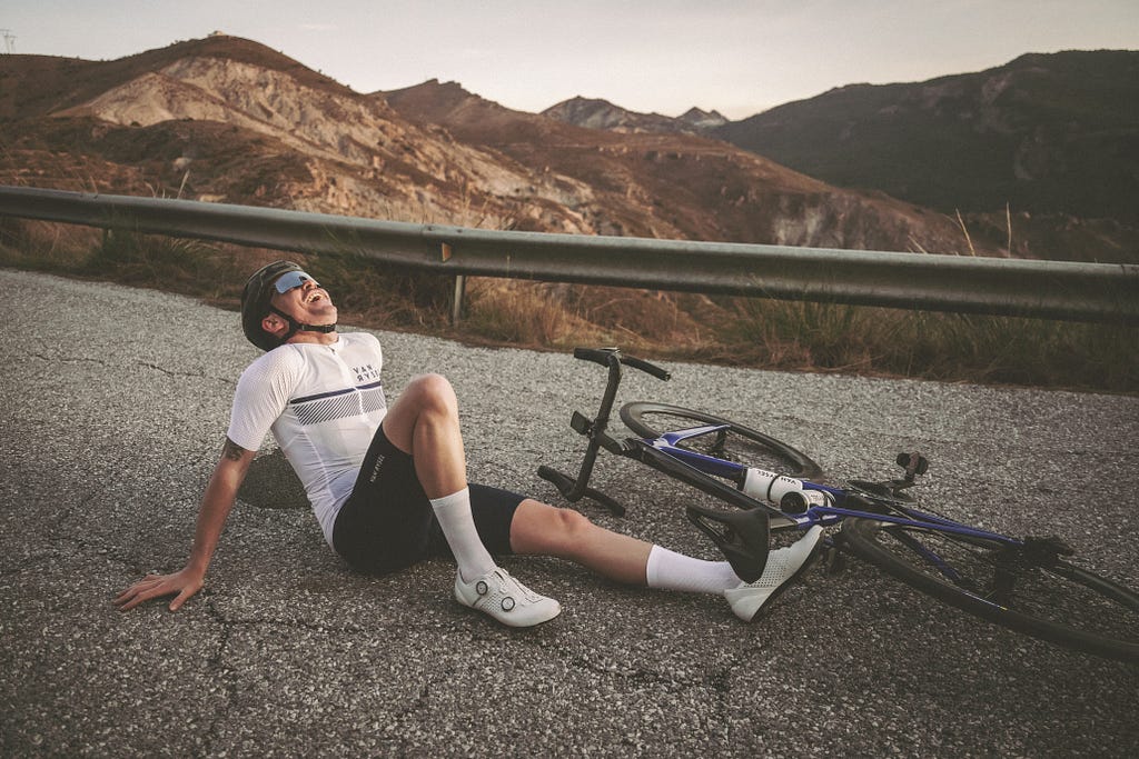 Stock picture, showing a person on the floor with their bike on the floor too. It seems they fell (representing the failure)