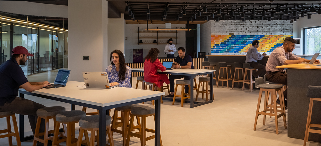 People working together in a lounge at Daftarkhwan | Downtown.