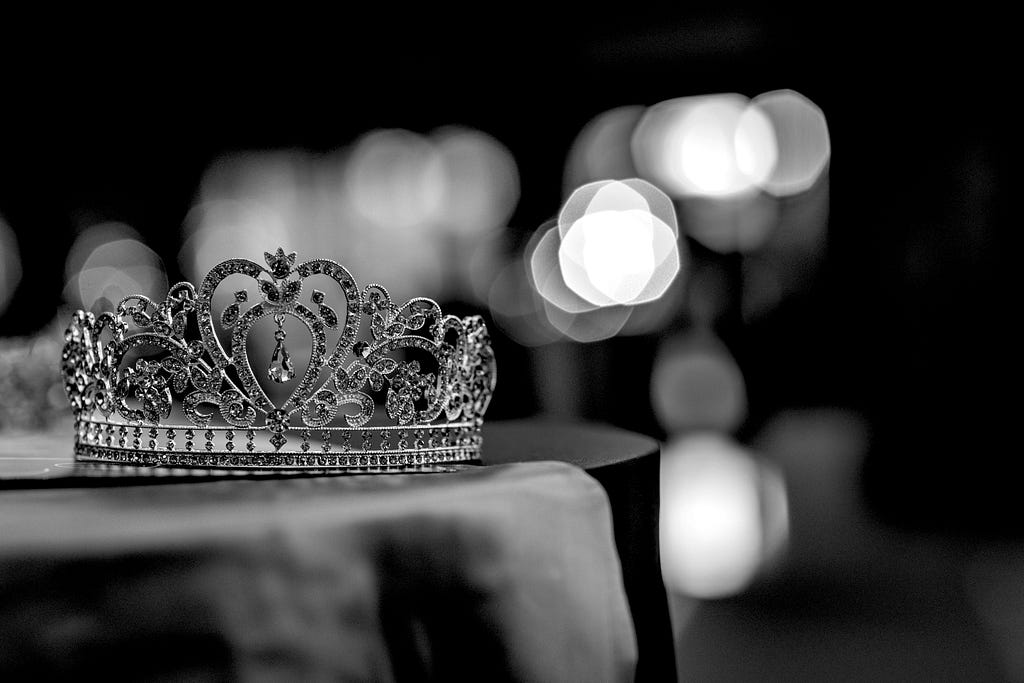 A jeweled crown sits on a table