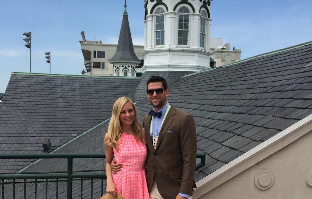 Jeff Kunowski poses with his wife at Churchill Downs, where the Kentucky Derby takes place.