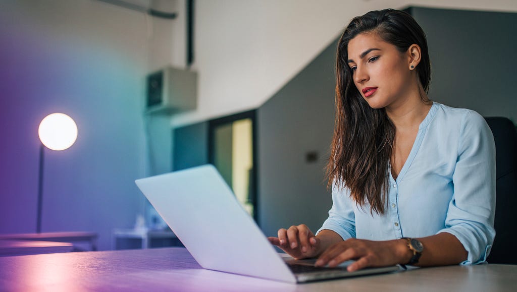 Business woman using a laptop at a desk