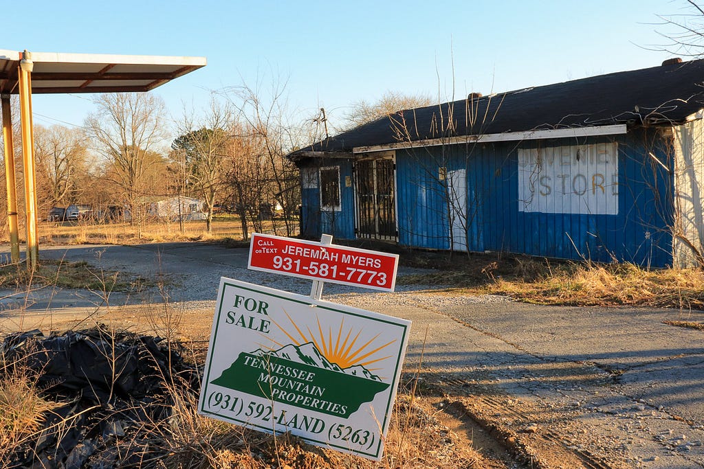 Exterior view of a long-abandoned and long-for-sale former convenience store in Tracy City, TN.