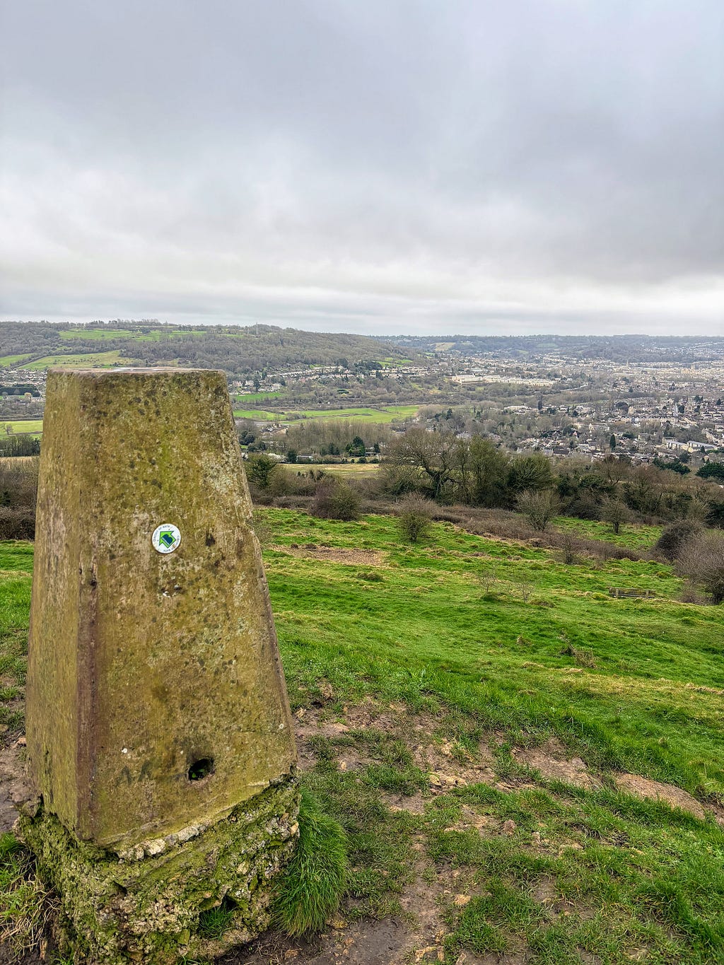 The stone trig point on top of Solsbury Hill