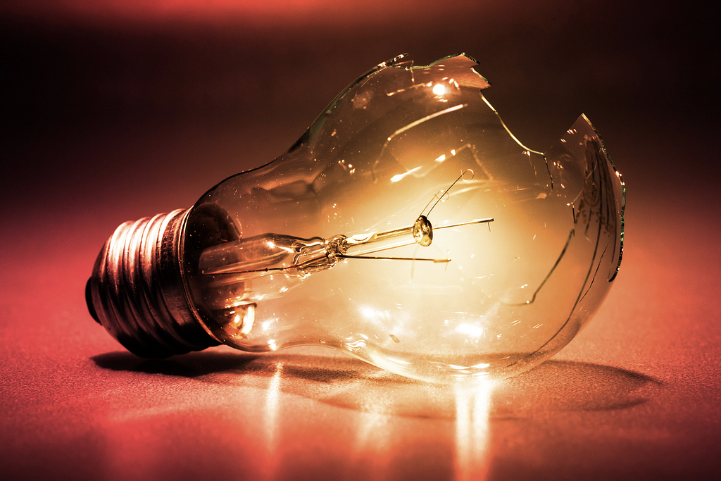 A broken incandescent light bulb depicting data analytics challenges