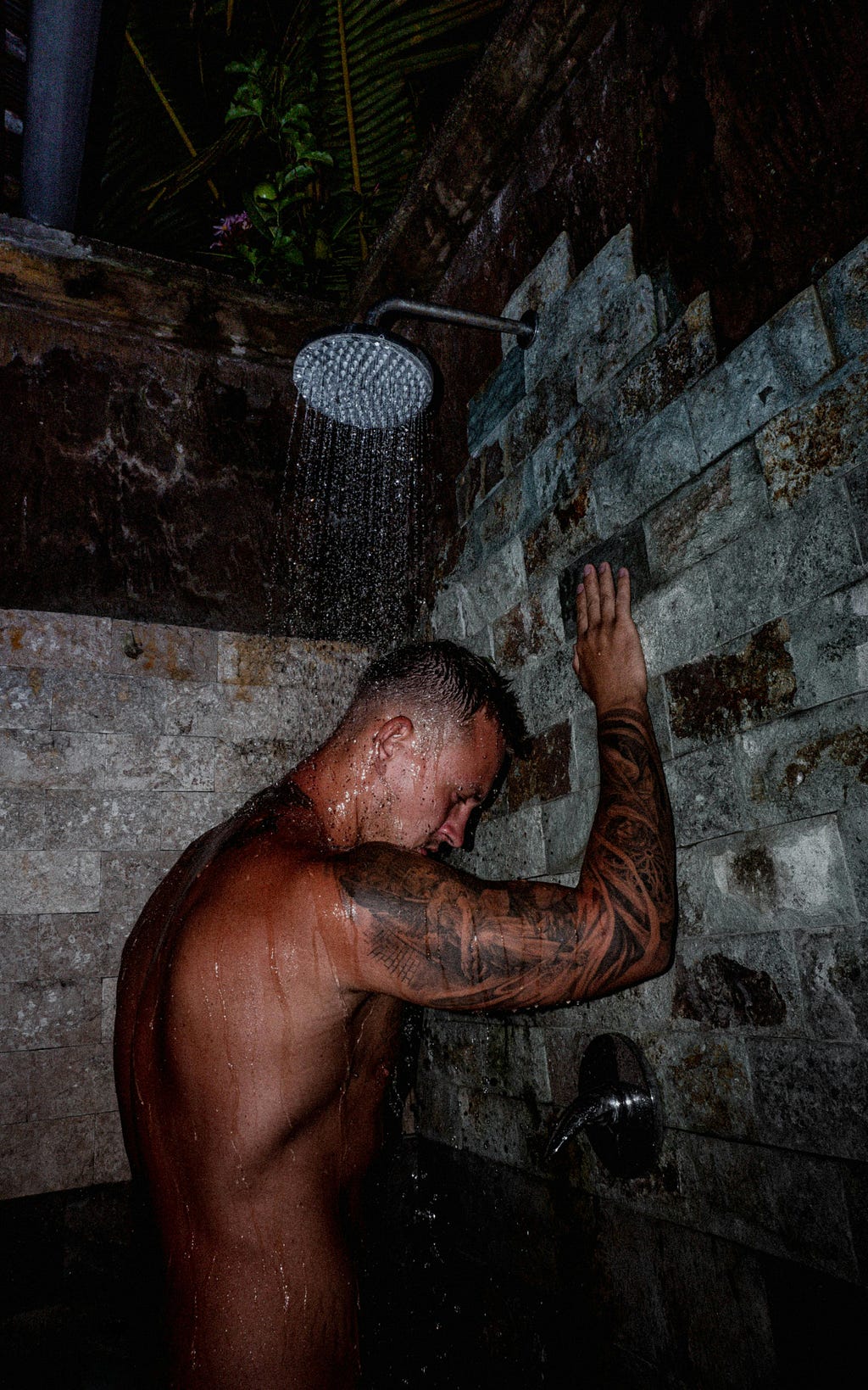 Naked man showering