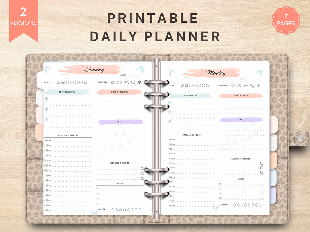 Image of Printable Daily Planner Inserts, displayed in an A5 size, 6-ring binder. Both Sunday and Monday pages are visible.