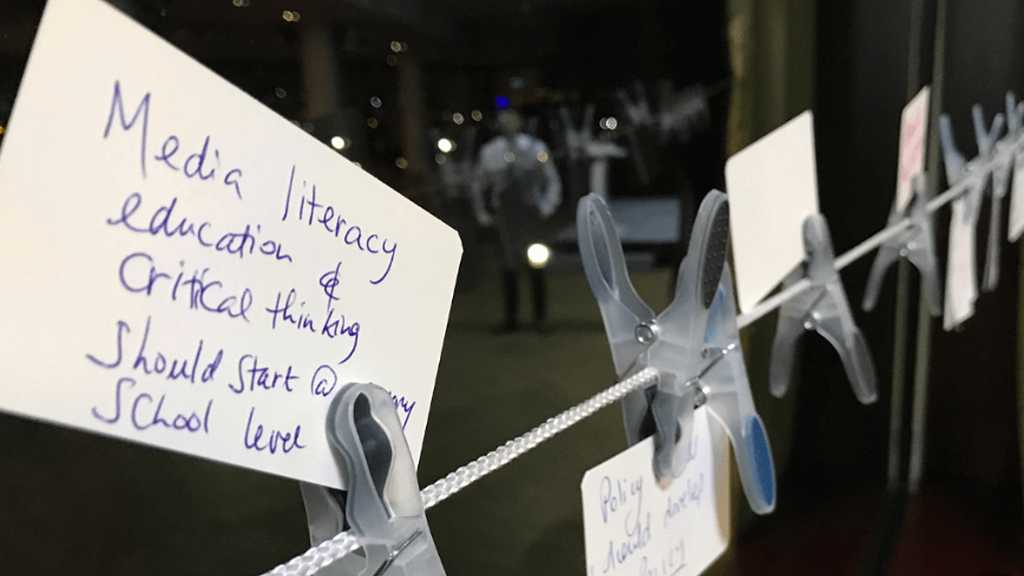 A washing-line becomes a means of delegates leaving pegged hand-written observations