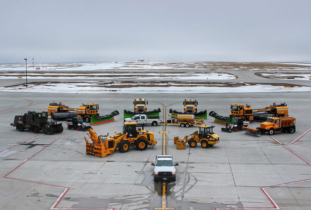 Construction vehicles on the tarmac at Williston airport