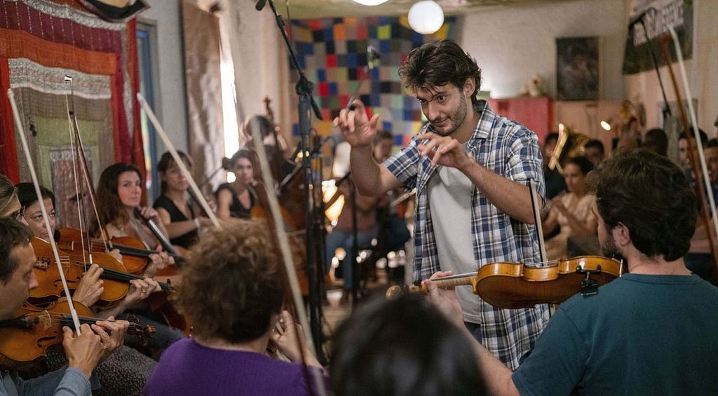 The main character of the movie conducts an orchestra with his bare hands