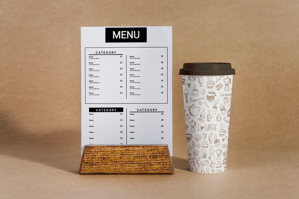 A simple restaurant menu template and a paper cup