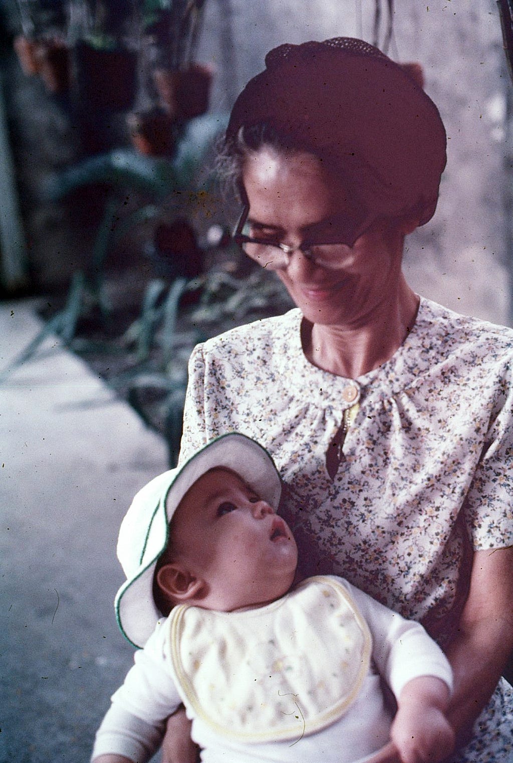 Grandma with my cousin in her arm