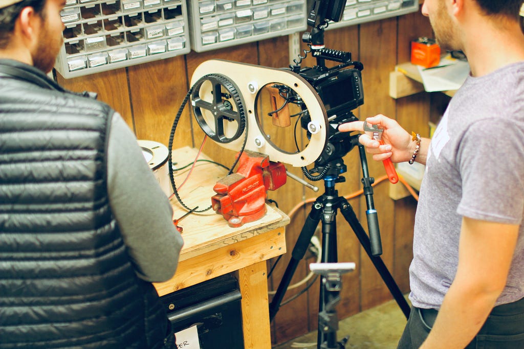 two men documenting their product development process through a camera