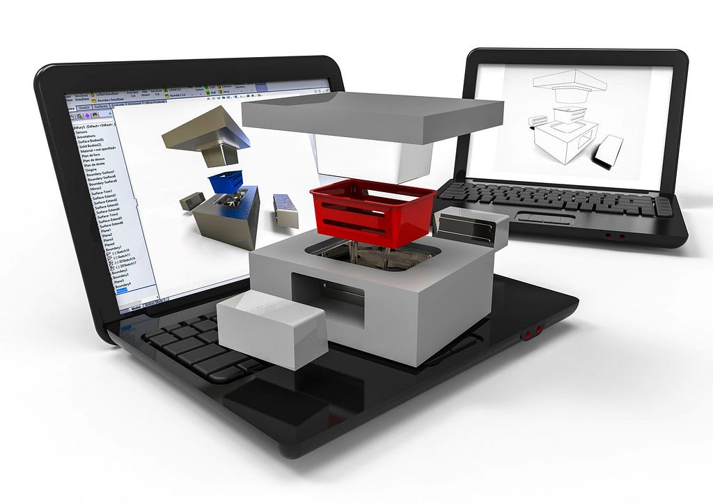 A laptop computer showing a visual model of plastic injection molded piece with the necessary aluminum or steel tooling surrounding it. Modern engineering and design are almost exclusively digital.