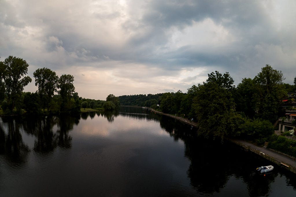 Early morning view from a bridge across the river Ruhr. Mülheim a. d. Ruhr, Germany, July 2, 2023.