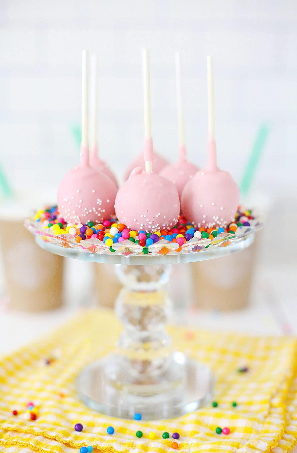 Finished Starbucks birthday cake pops arranged on a cake stand