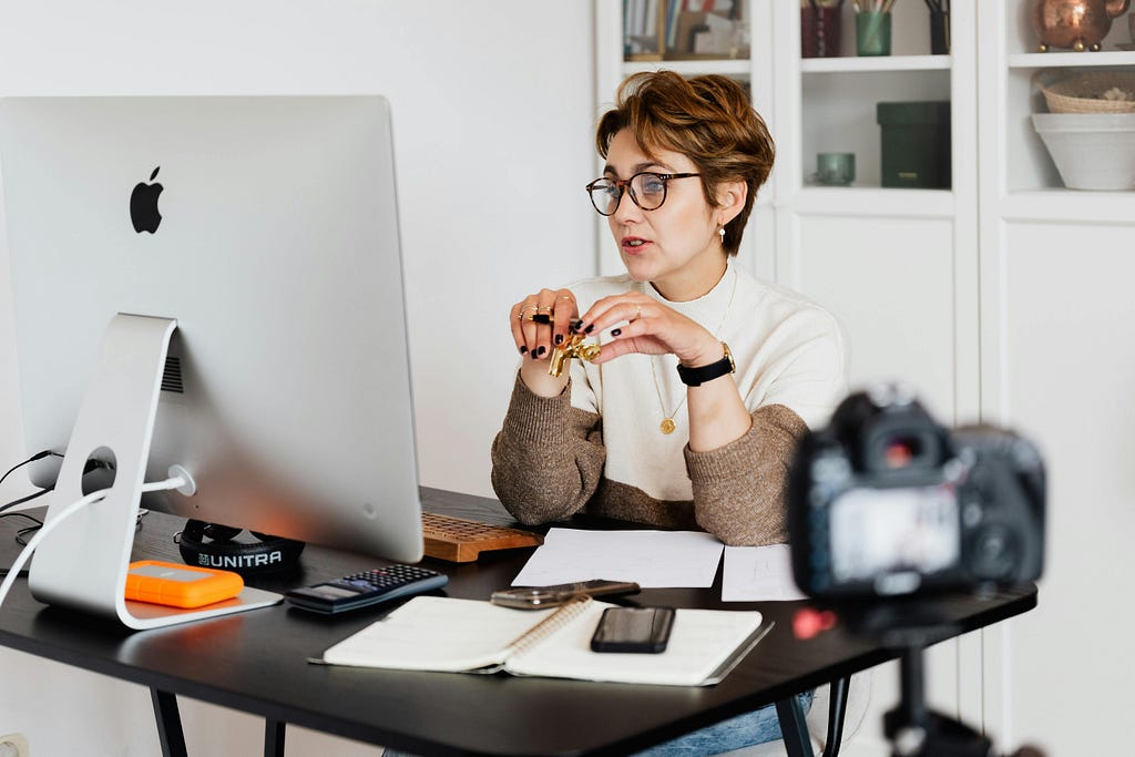 A woman entrepreneur conducting an online live webinar.