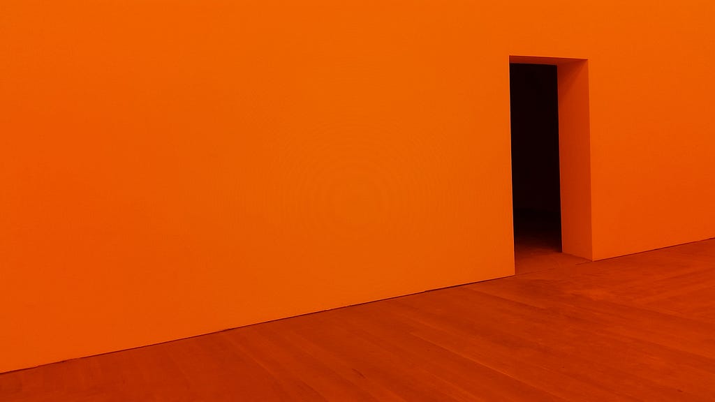 An empty orange wall