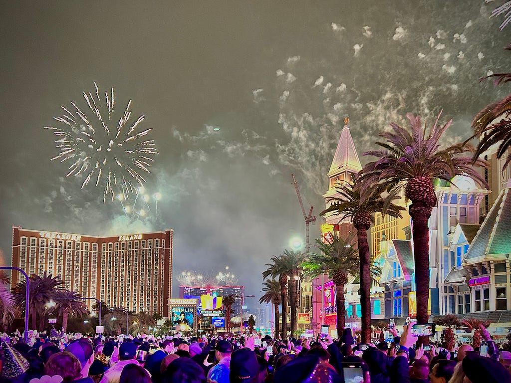 Fireworks and crowded people on the street around hotels in Las Vegas