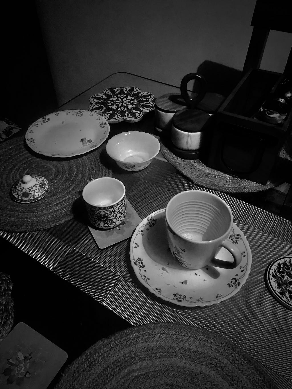 dinig table with empty tea cups in evening light