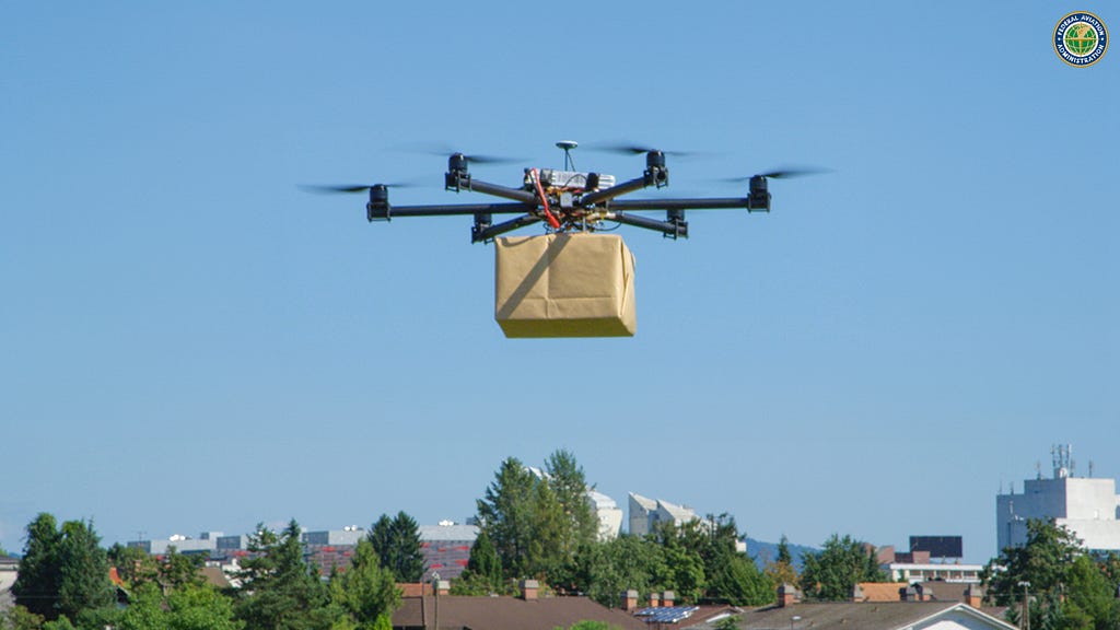 A drone delivering a package over a suburban community.