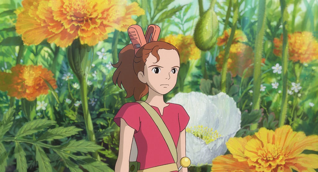 a girl looking angry in the flowers. Has a clip in a her.