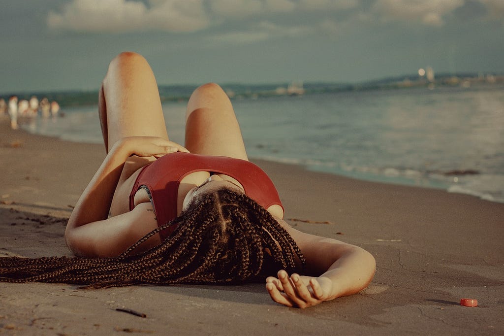 bbw model posing on the beach