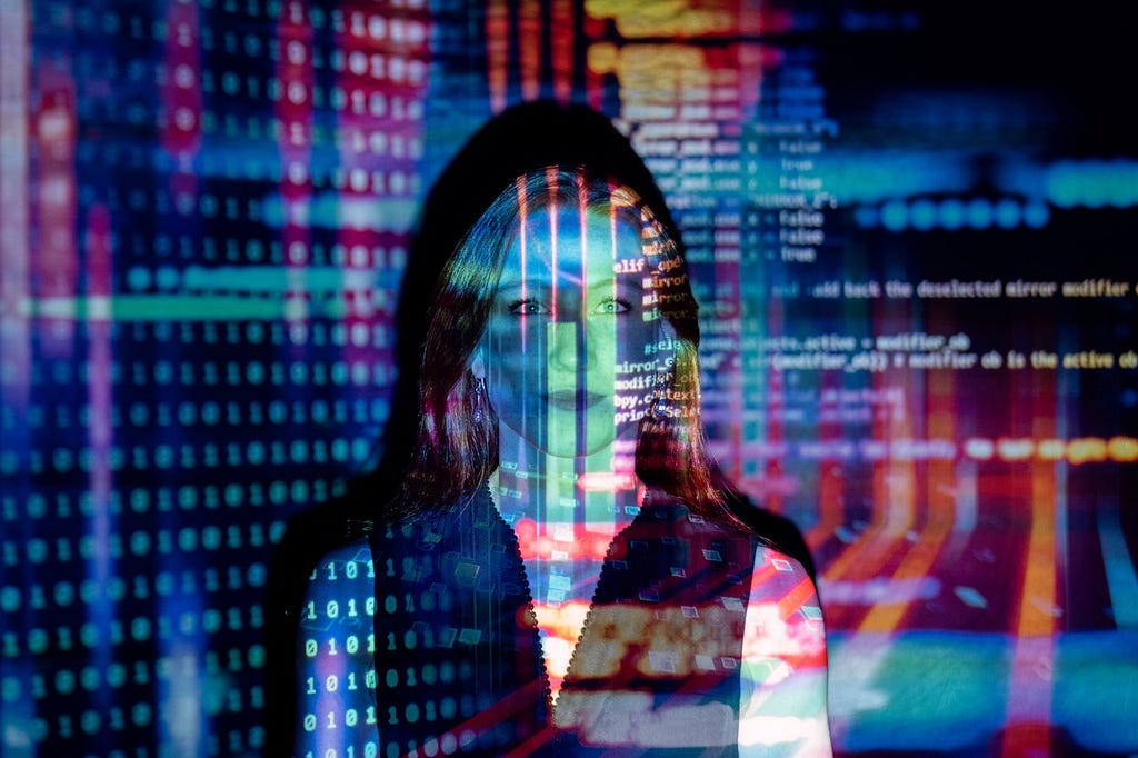 Programming code projected on a woman