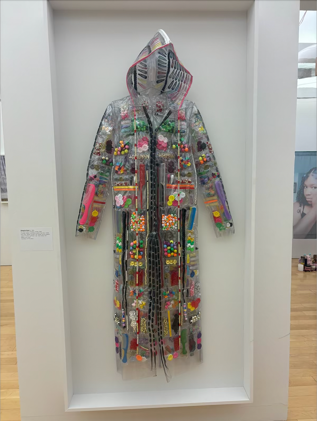 Pictured above, For the Culture Product Jacket (Shaquita Reed, 2021) The jacket is composed of crystals, barrettes, plastic hair ties, metal hair clips, plastic combs, hair beads, phony beads, rubber bands, synthetic hair, shoe laces, hair ribbon and vinyl.