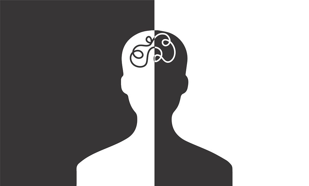 Silhouette of a human head split into white and black