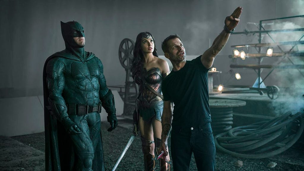 Zack Snyder directing Ben Affleck as Batman and Gal Gadot as Wonder Woman.