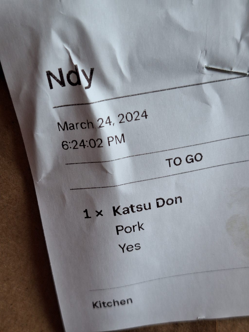 A receipt for “Ndy”, which is almost my name, saying 1x Katsu Don, Pork, yes. Pork. YES.