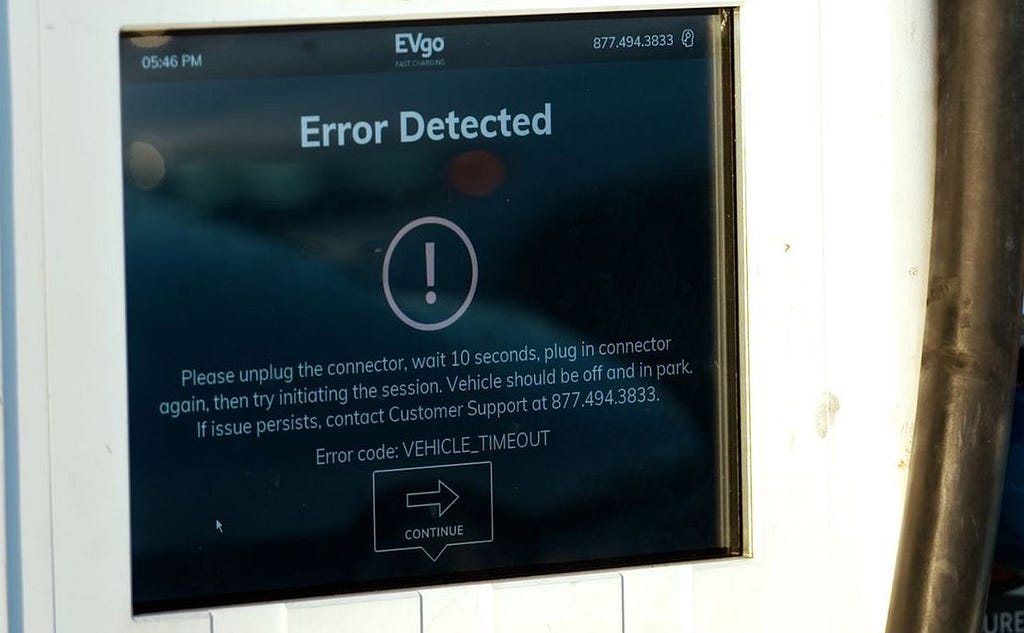Screen of a charging station showing a technical error code with complex instructions on how to proceed