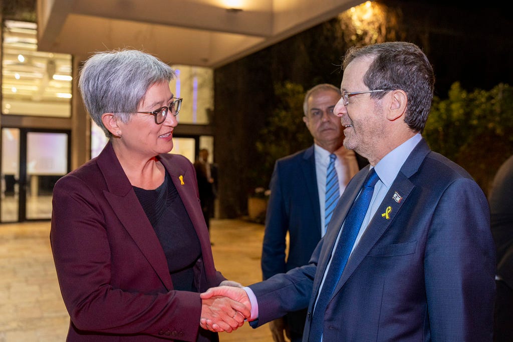 Wong shaking hands with Israeli President Herzog