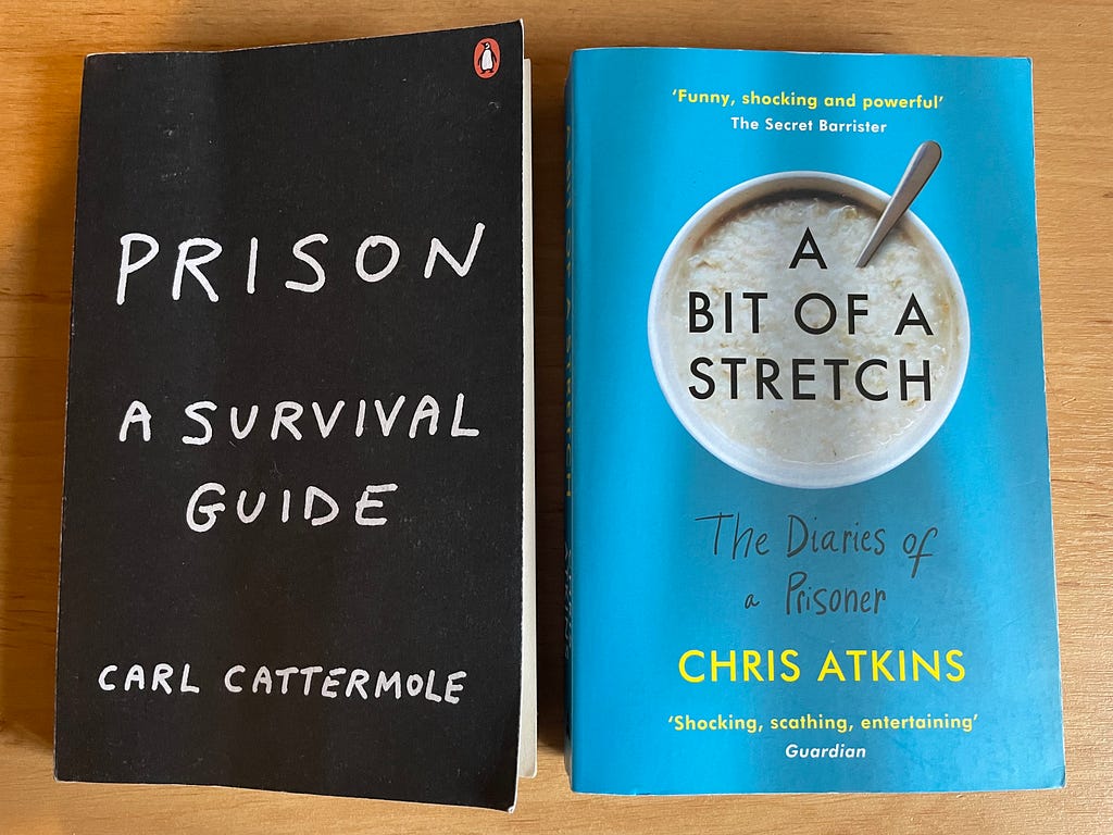 Two books: Carl Cattermole’s Prison Survival Guide & Chris Atkins ‘A bit of a Stretch’.