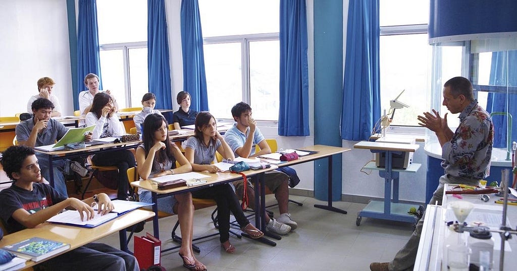 A teacher at the German School Jakarta teaches his chemical science students