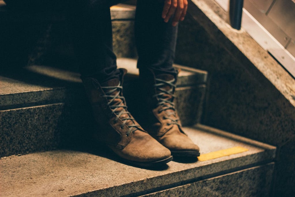 Camila Damásio took this photo of a woman’s  boots as she sat on a stoop.