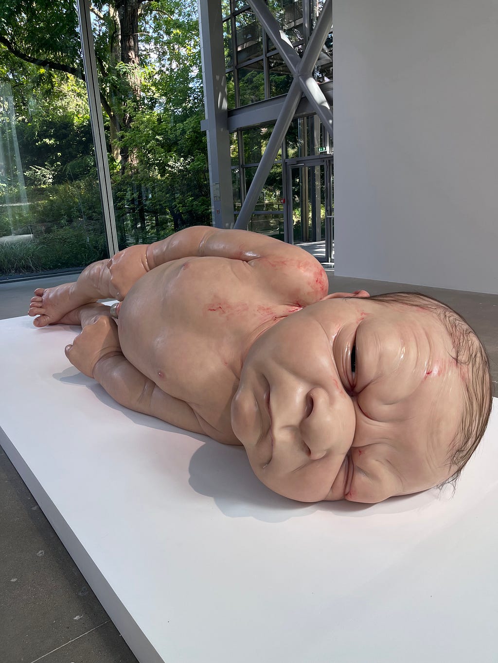 Giant realistic sculpture of a new born baby