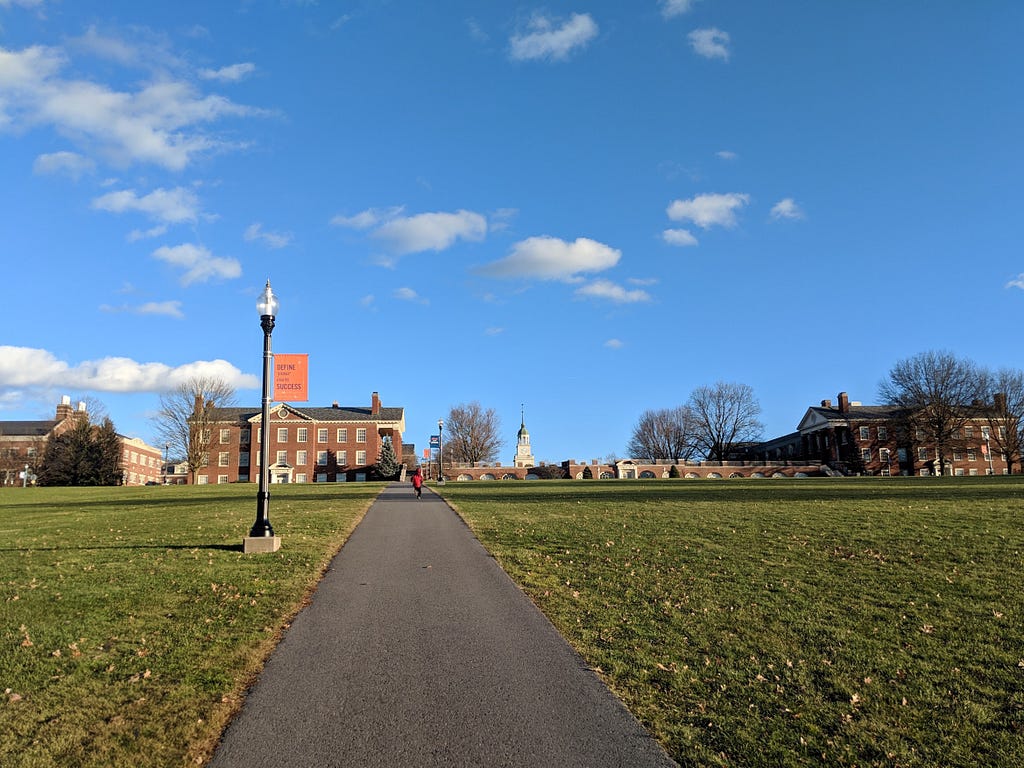 A picture of Buckell’s campus — blue skies, green grass, sunny