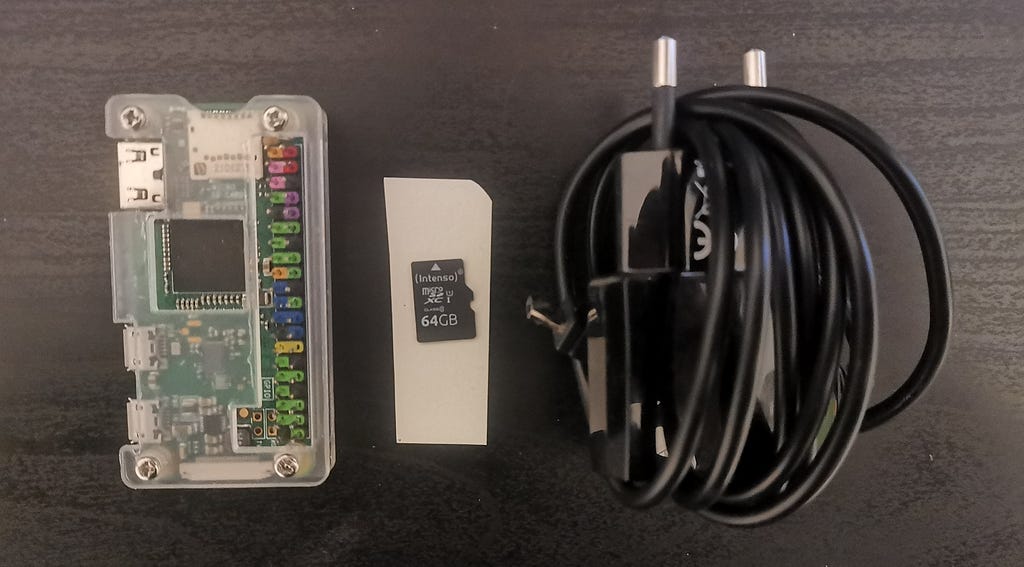 A Raspberry Pi Zero with case, micro SD card and power supply