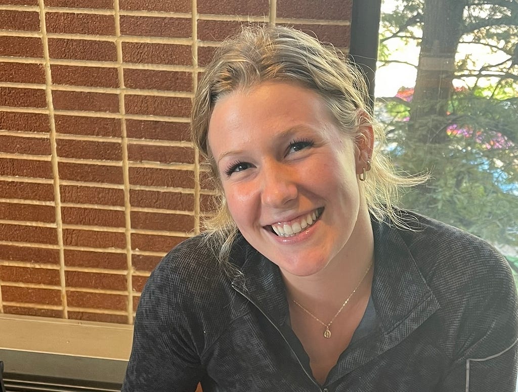 Ellie Cesarz smiles in Pius Xii Memorial Library on September 25, 2022, as she reflects on the upcoming year for her club volleyball team. Ellie Cesarz is newly captain and hopes to lead the women’s club volleyball team to victory.