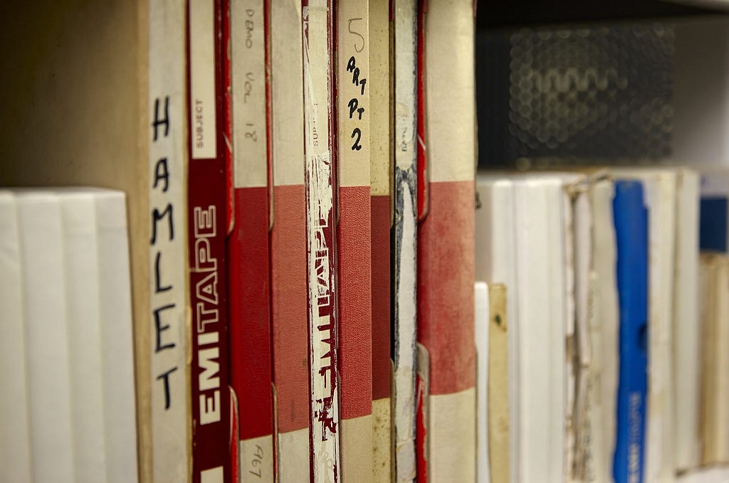 close up of audio files on a shelf in the storage area at the John Rylands Library.